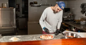 assembling the pizza