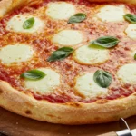 The finished pizza made with the ultimate di fara pizza dough recipe, ready to be sliced.