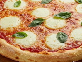 The finished pizza made with the ultimate di fara pizza dough recipe, ready to be sliced.